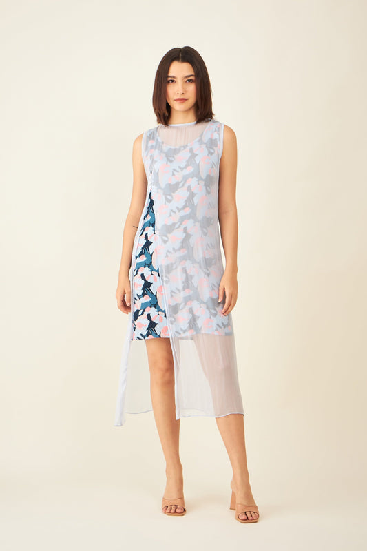 a short blue dress with a longer sheer lay on top.
